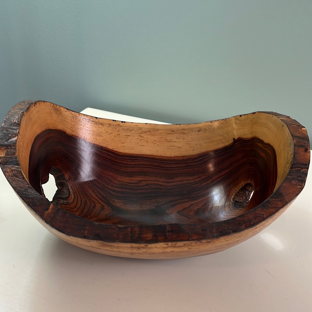 Small hand carved wooden bowl.